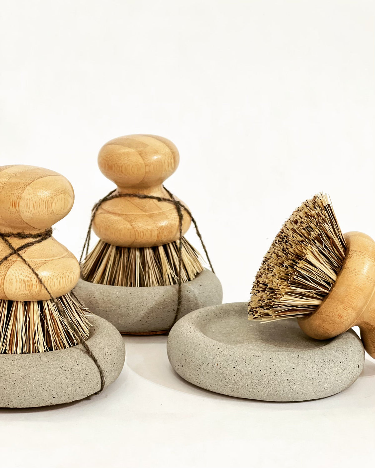 Wood Scrub Brush In A Concrete Dish