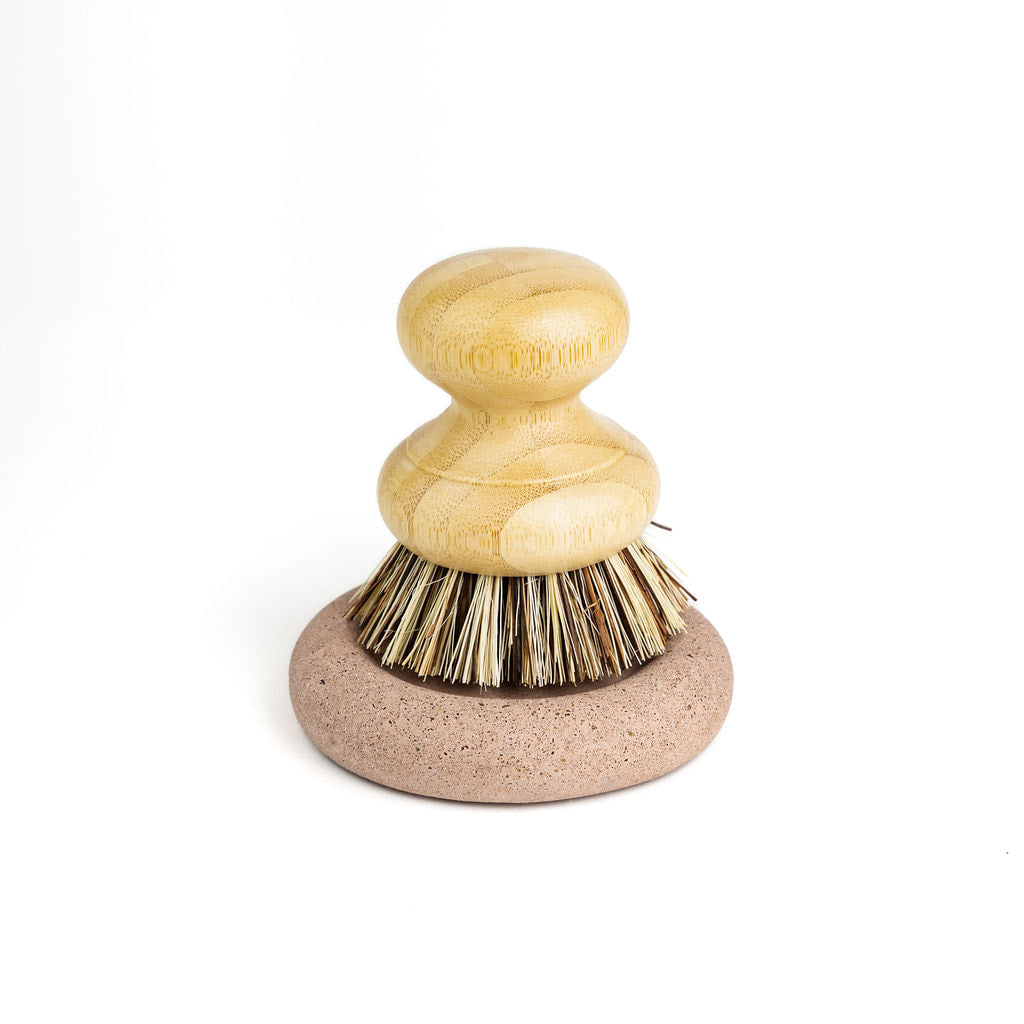 Wood Scrub Brush In A Concrete Dish
